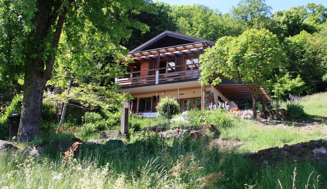 2-star chalet in a green setting with a view of the Romanesque Abbey